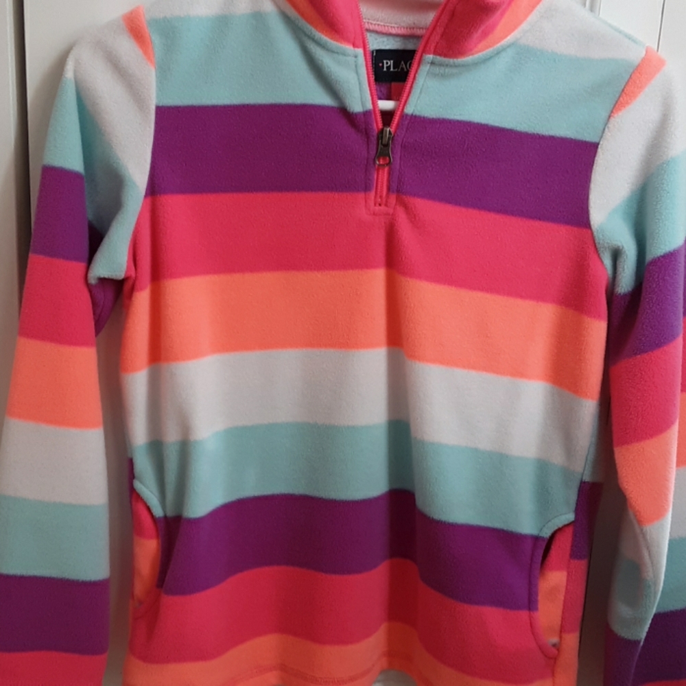 A rainbow striped shirt